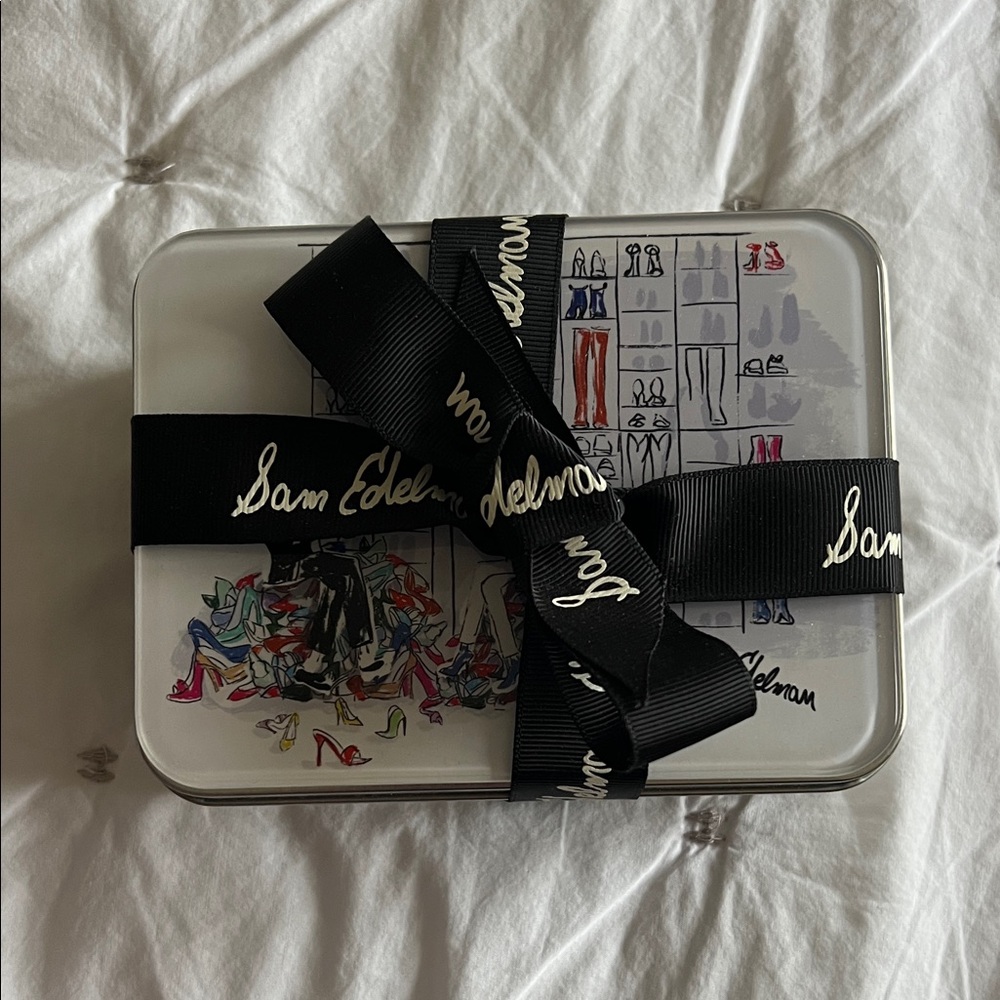 Sam Edelman Limited Edition Puzzle Tin with Black Ribbon